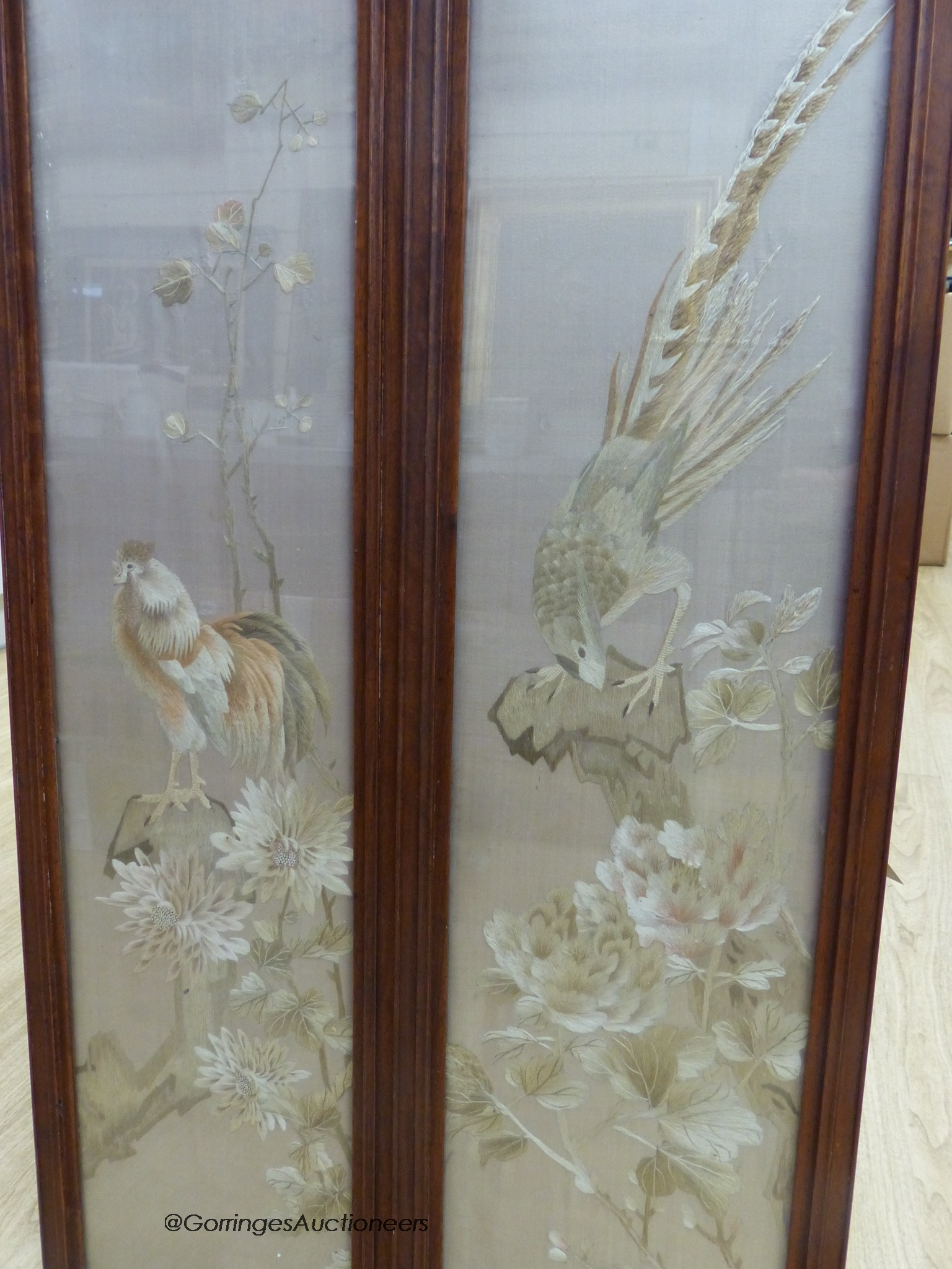 A pair of late 19th century Chinese embroidered silk pictures, in hongmu frames, 111 cm x 29 cm in total